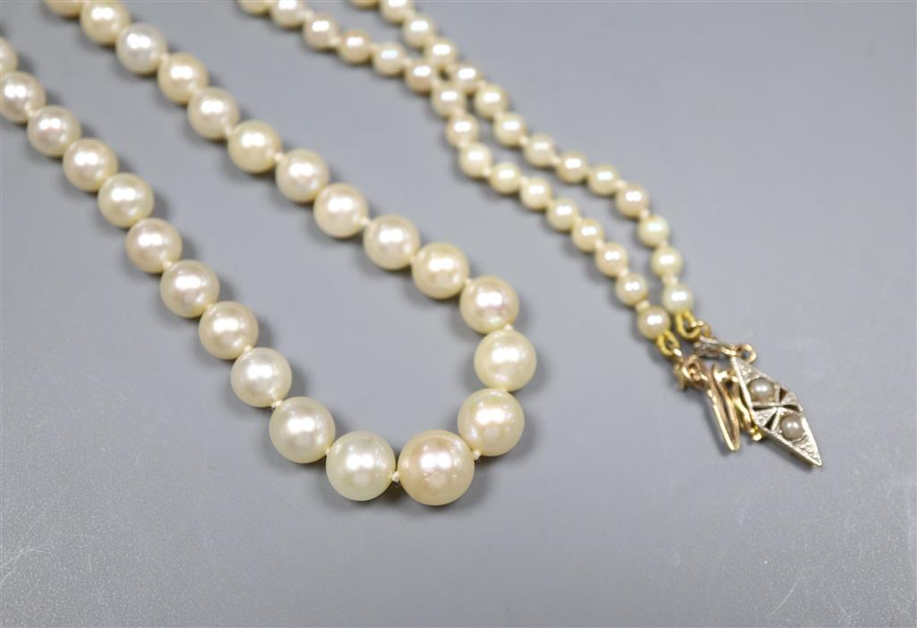 A single strand cultured pearl necklace with yellow metal clasp and a pair of 9ct gold and cultured pearl earrings,